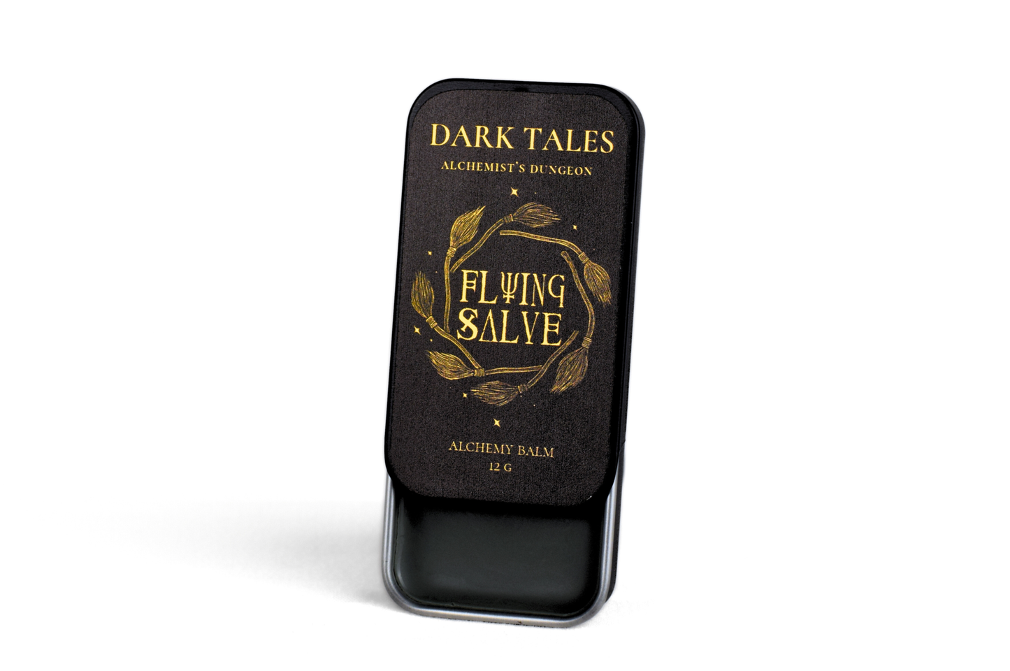 Flying Salve 12g natural witchcraft ointment with wormwood, rosemary, lavender, frankincense, and dark vanilla in a slide lid container.