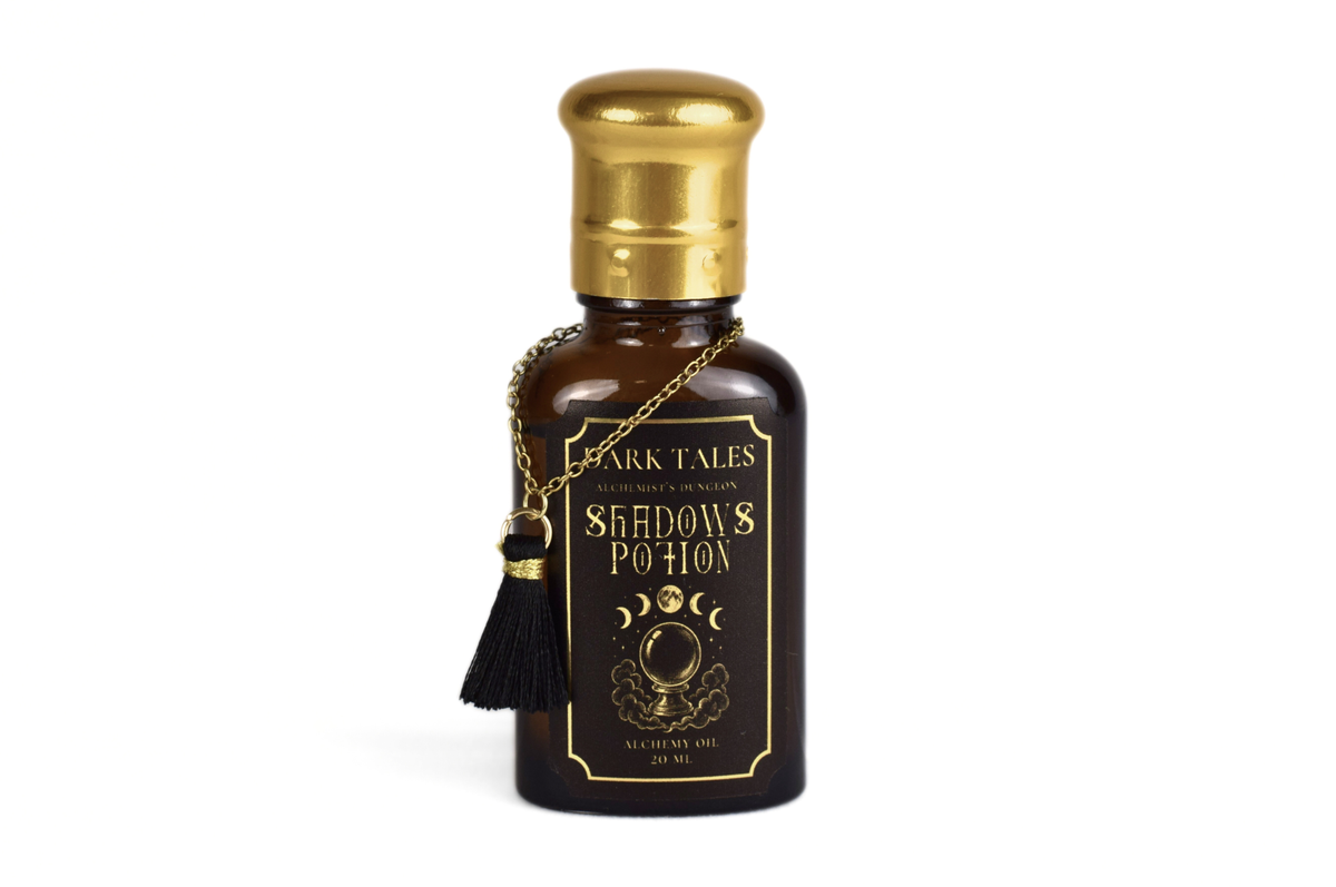 Shadows Potion dark brown glass bottle with gold cap, black label, gold detailing, chain and tassel