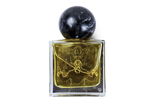 Amadeus parfum in a clear rectangular glass bottle with golden liquid, skull artwork, and a black marbled sphere cap