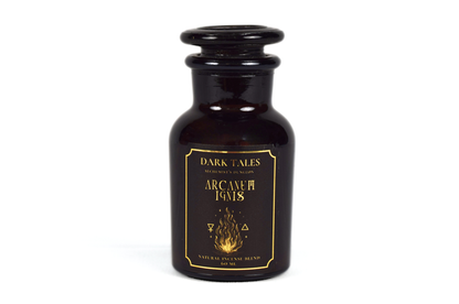 Arcanum Ignis incense blend in a dark brown apothecary glass bottle with black and gold label