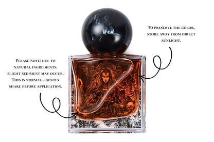 BLOODY MARY parfum in a clear rectangular glass bottle with amber liquid, dark marbled round cap, and illustrated label