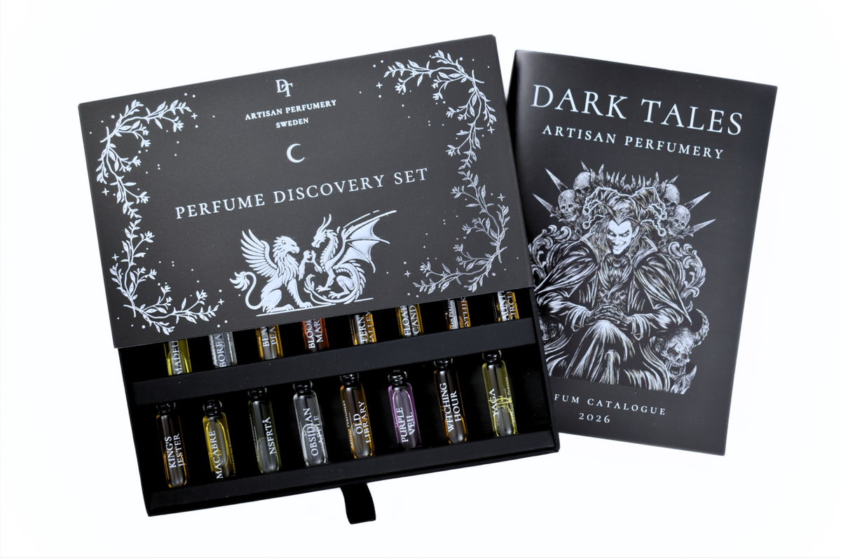 Discovery Set black perfume sample box with 16 miniature bottles, silver botanical artwork, and illustrated fragrance catalogue