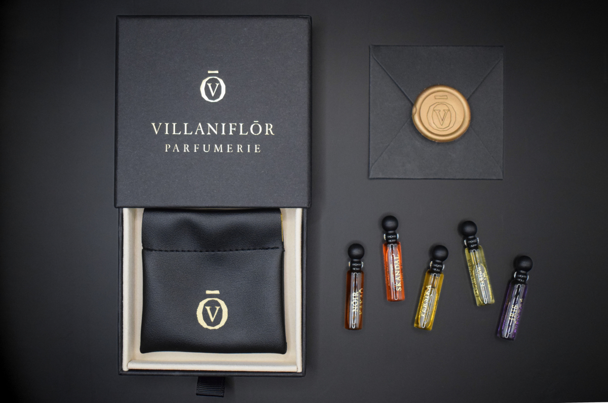 Discovery Set of five miniature perfumes in slim glass vials, presented with a black VILLANIFLŌR box and pouch