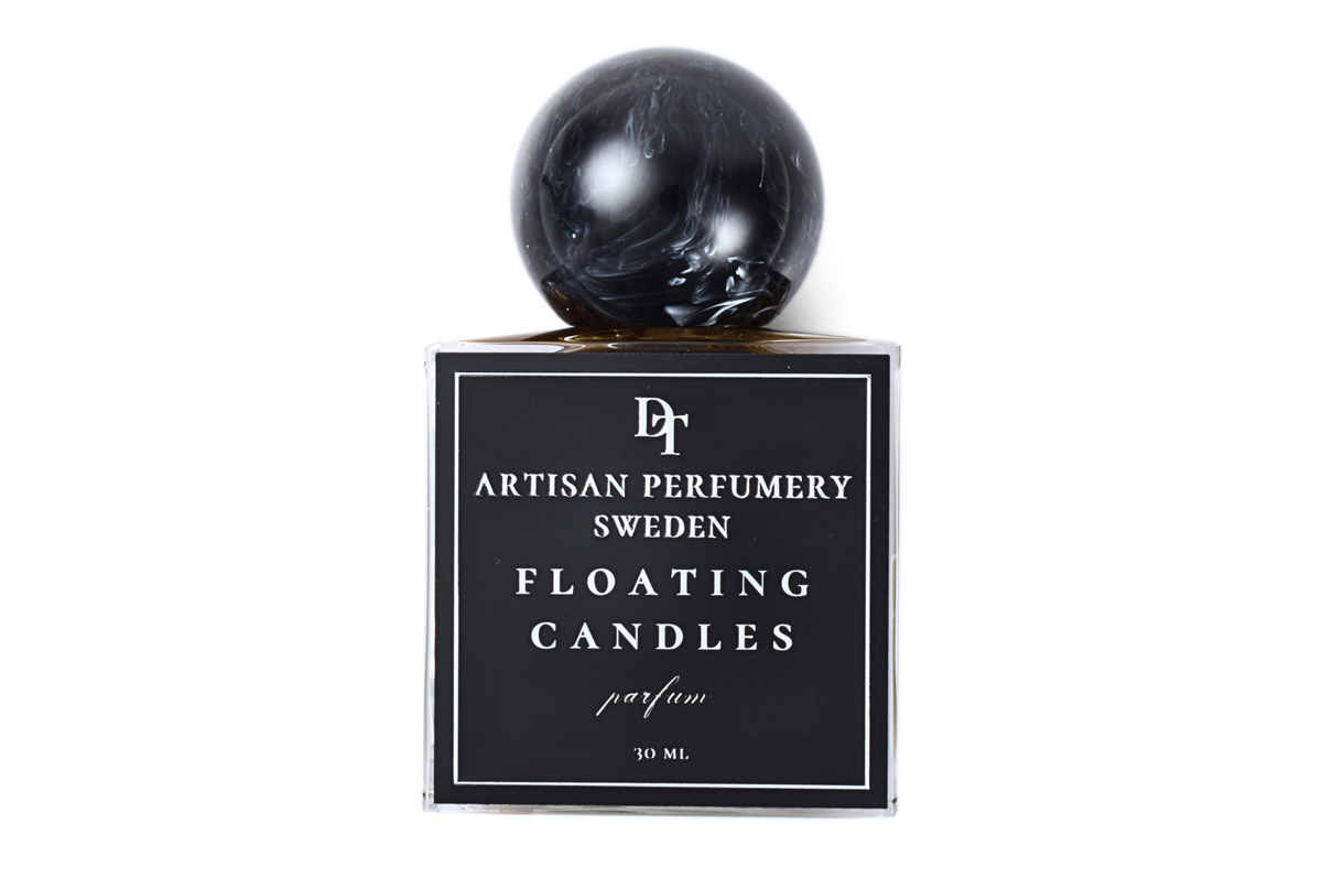 Floating Candles 30 ml parfum in a clear square bottle with black label and glossy black marbled sphere cap