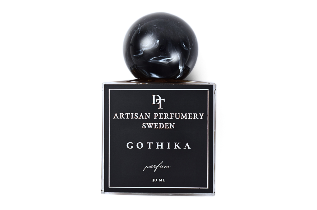 Gothika black glass parfum bottle with glossy spherical cap, white label, and 30 ml volume