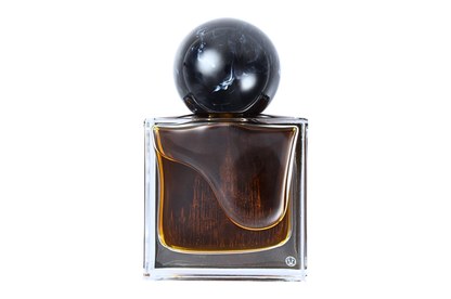 Gothika parfum in a clear square glass bottle with dark amber liquid, cathedral illustration, and black spherical cap