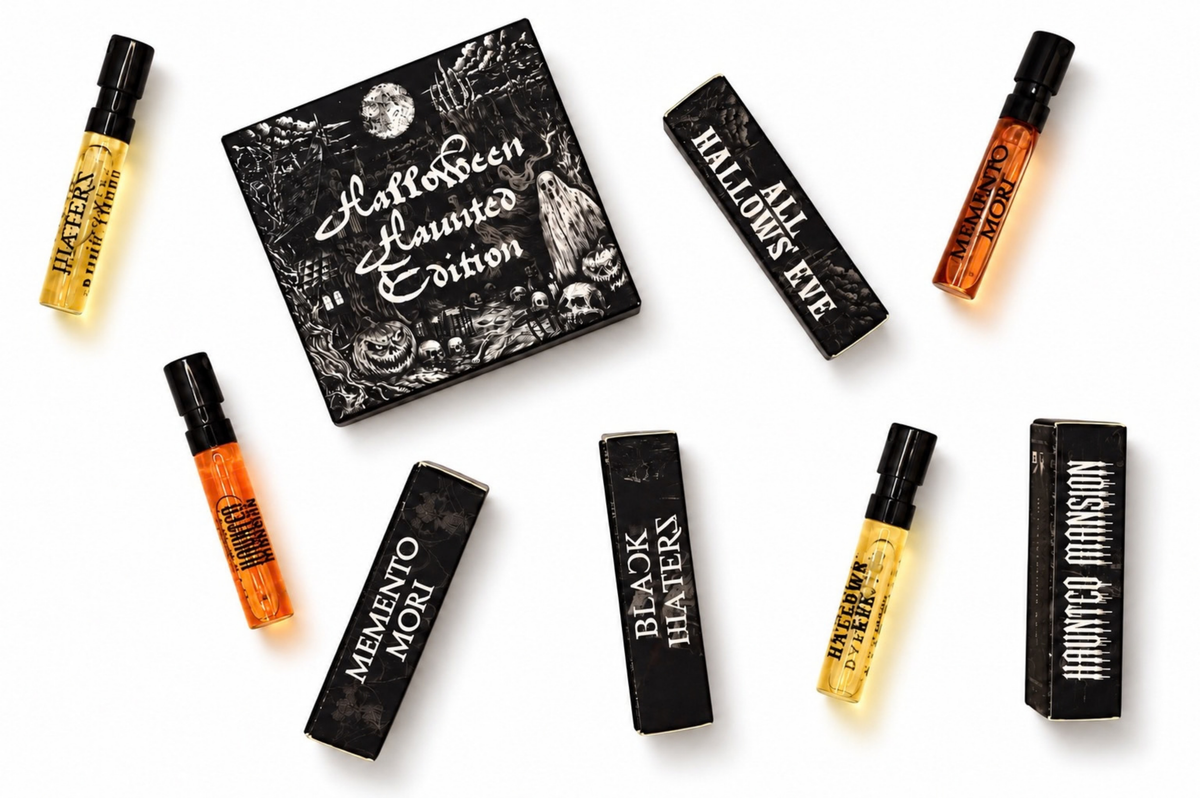 HALLOWEEN HAUNTED EDITION parfum sample set with four amber spray vials and black illustrated fragrance boxes