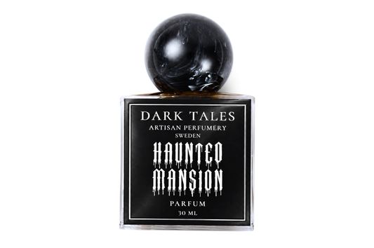 Haunted Mansion parfum in a clear square glass bottle with black label and glossy black spherical cap