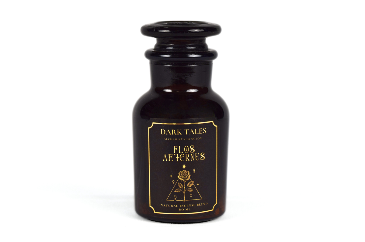Incense Blend in a dark brown glass apothecary bottle with a black stopper and ornate gold floral label
