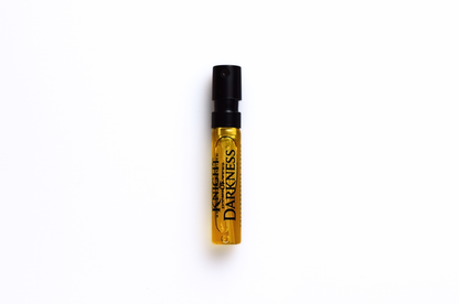 Parfum sample vial for Knight of Darkness with amber liquid, clear glass, black spray cap, and bold printed label