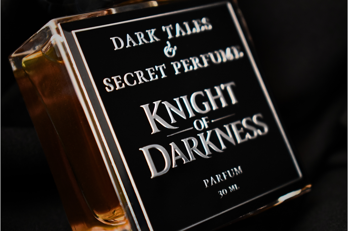 Knight of Darkness black glass parfum bottle with amber liquid, silver lettering, and 30 ml label