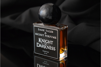 Knight of Darkness parfum bottle with amber liquid, black marble sphere cap, and bold black label