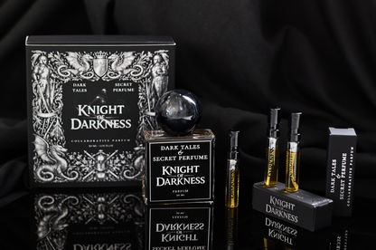 Knight of Darkness parfum in black box with ornate medieval artwork, black spherical cap, and sample vials