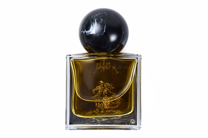 MACABRE parfum bottle with amber liquid, clear glass, ornate gold illustration, and glossy black spherical cap