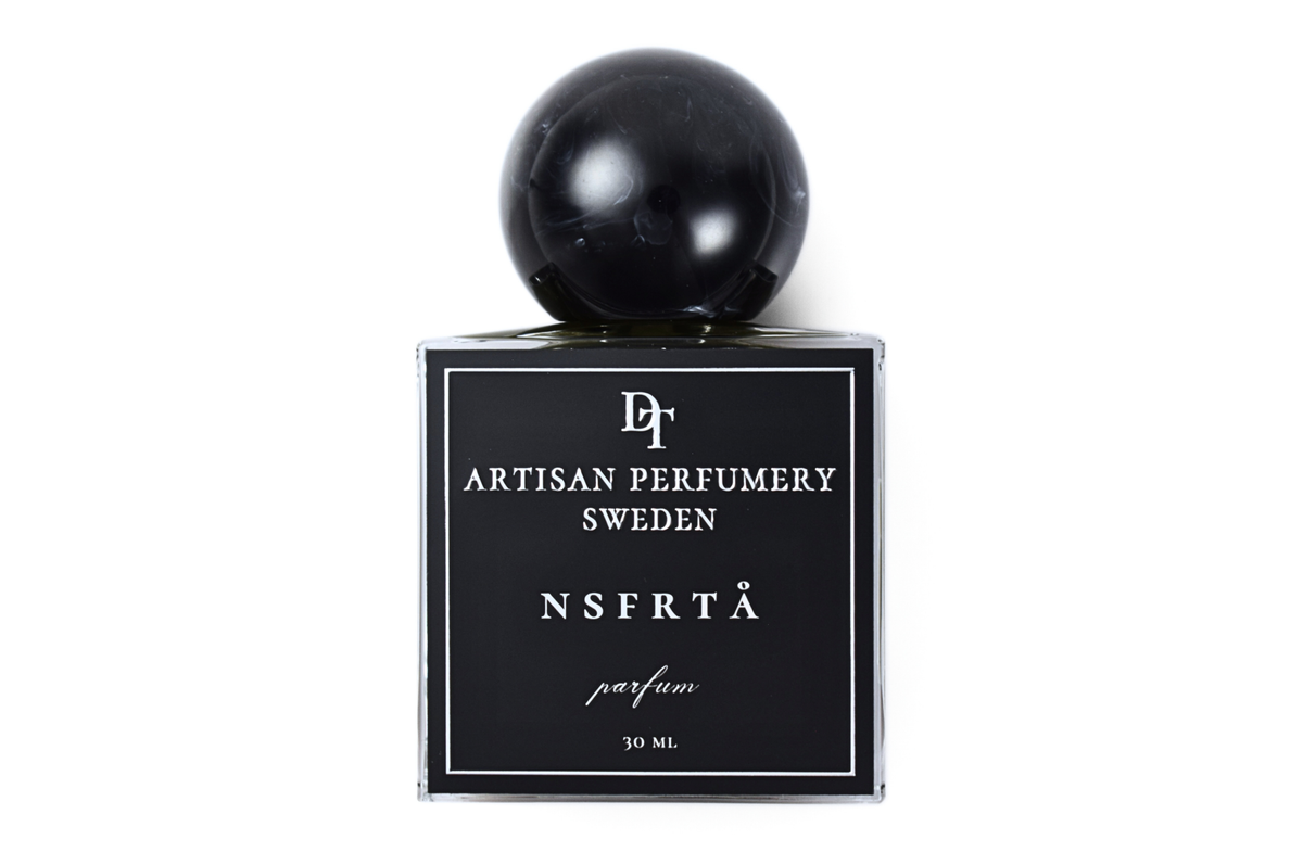 NSFRTÅ black glass parfum bottle with round black resin cap, minimalist label, and 30 ml volume
