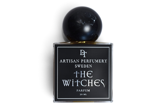The Witches | Parfum black glass perfume bottle with round black resin cap and square label, 30 ml